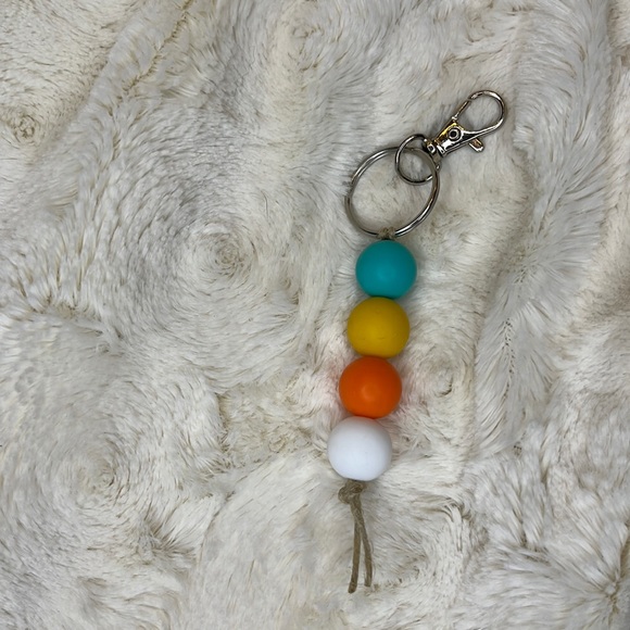 Handmade 15mm silicone bead keychain or zipper pull. Teal/yellow/orange/white. - Picture 2 of 3